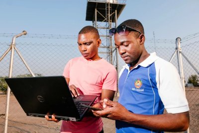 Technicians in Mozambique monitor drinking water desalination process